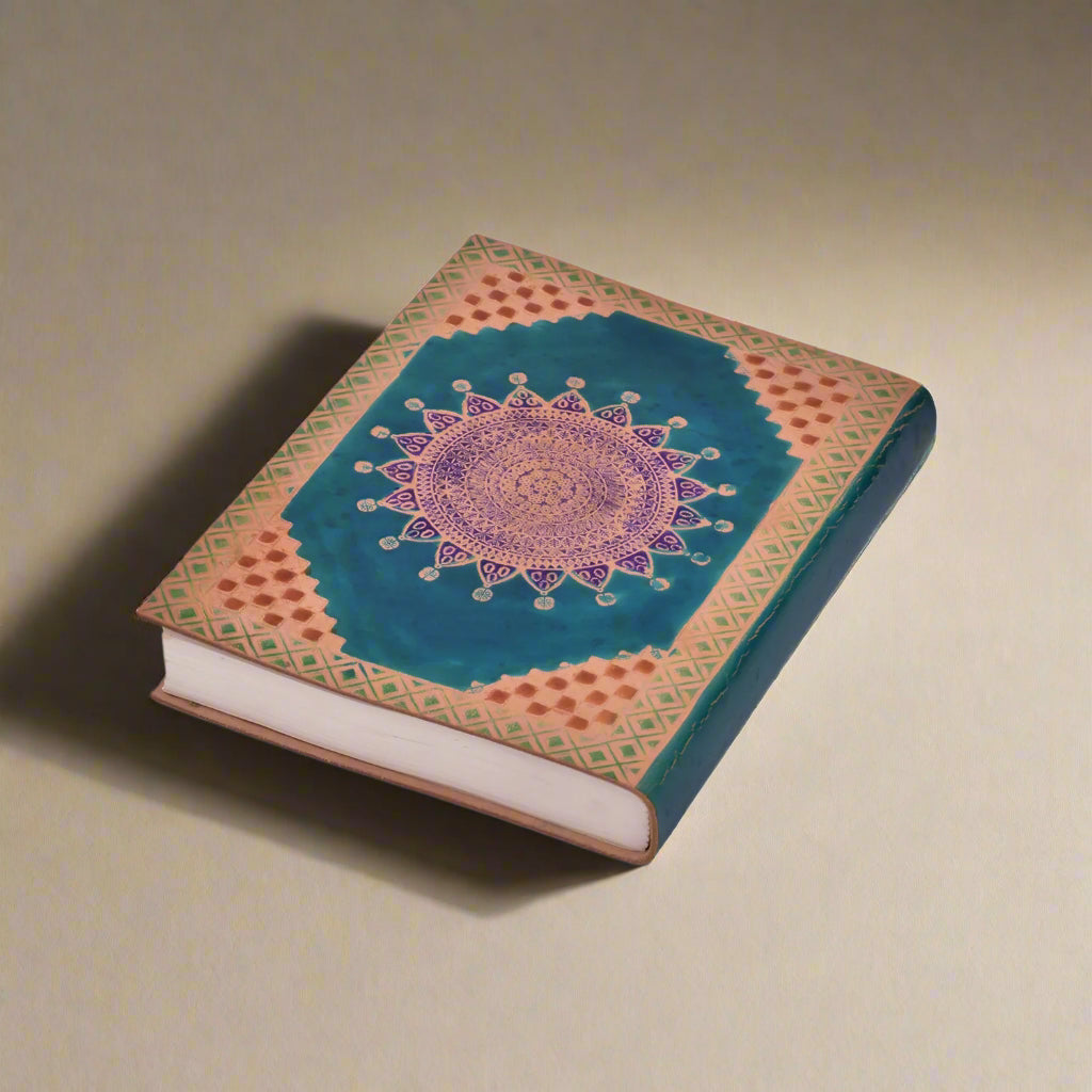 Decorative notebook with mandala design on a white background
