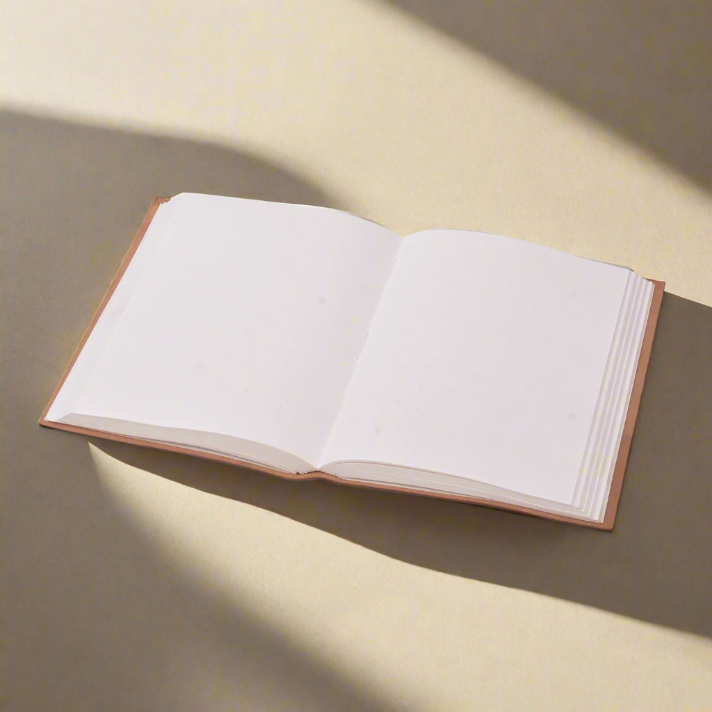 Open book with blank pages on a white background