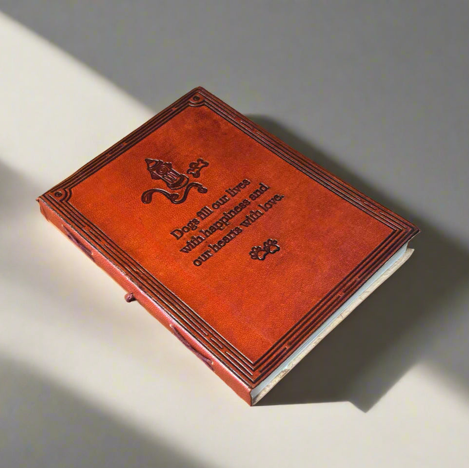 Brown leather book with embossed design on a matching brown background