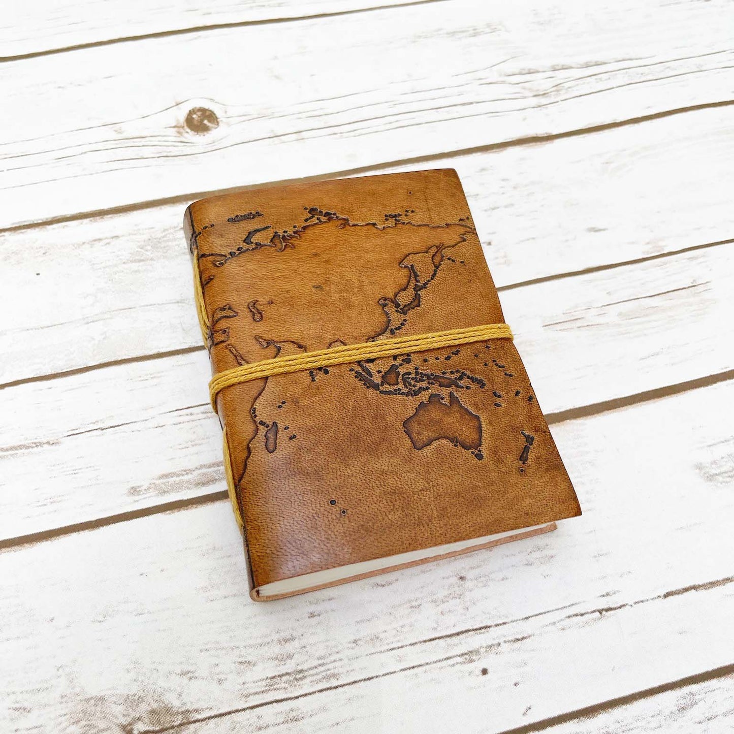 Vintage-style world map leather journal – ideal gift for travelers, writers, and geography lovers