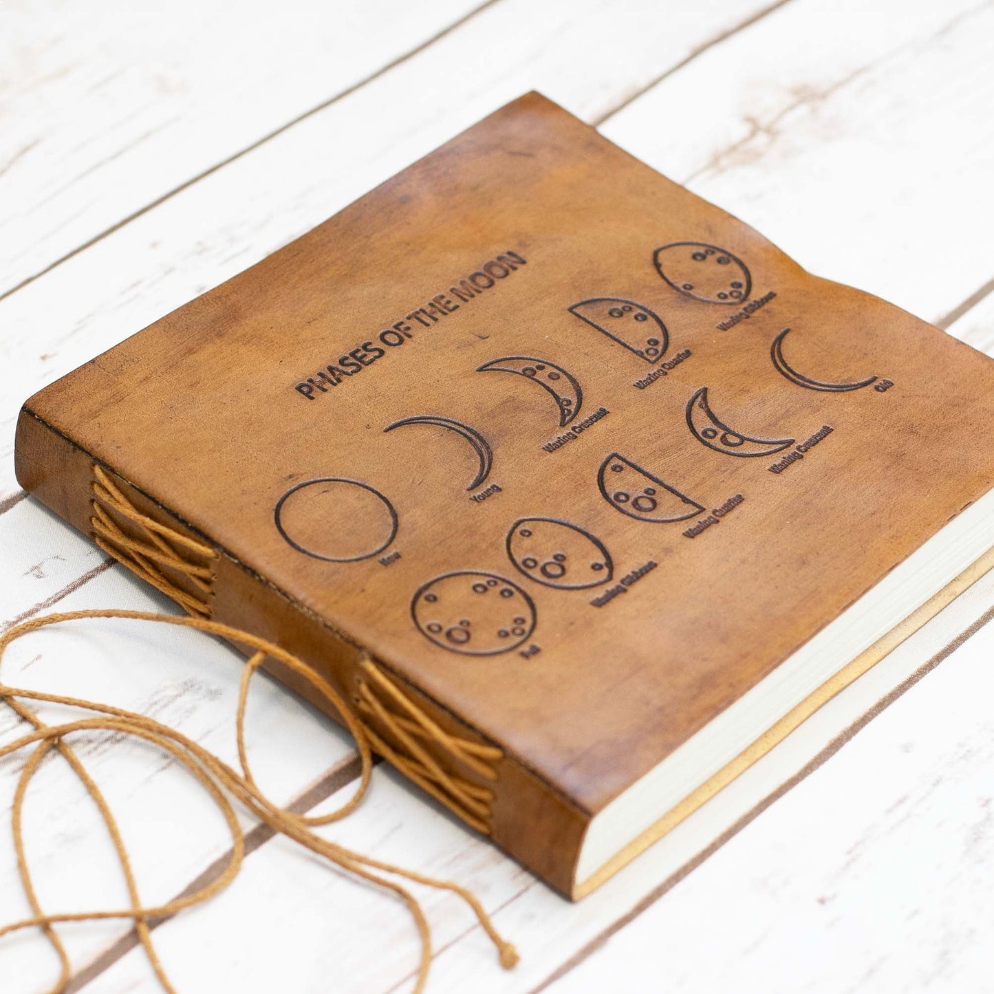 Soothi leather journal embossed with moon phases – celestial-inspired, handcrafted notebook for lunar journaling, intention setting, and spiritual reflection