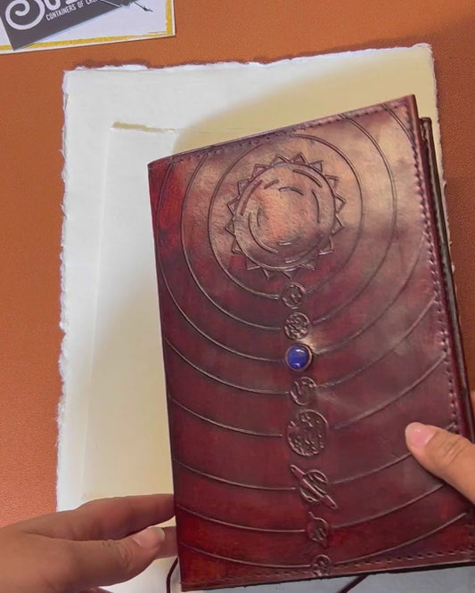 Space-themed leather notebook – embossed with galactic elements and adorned with a blue cobalt stone