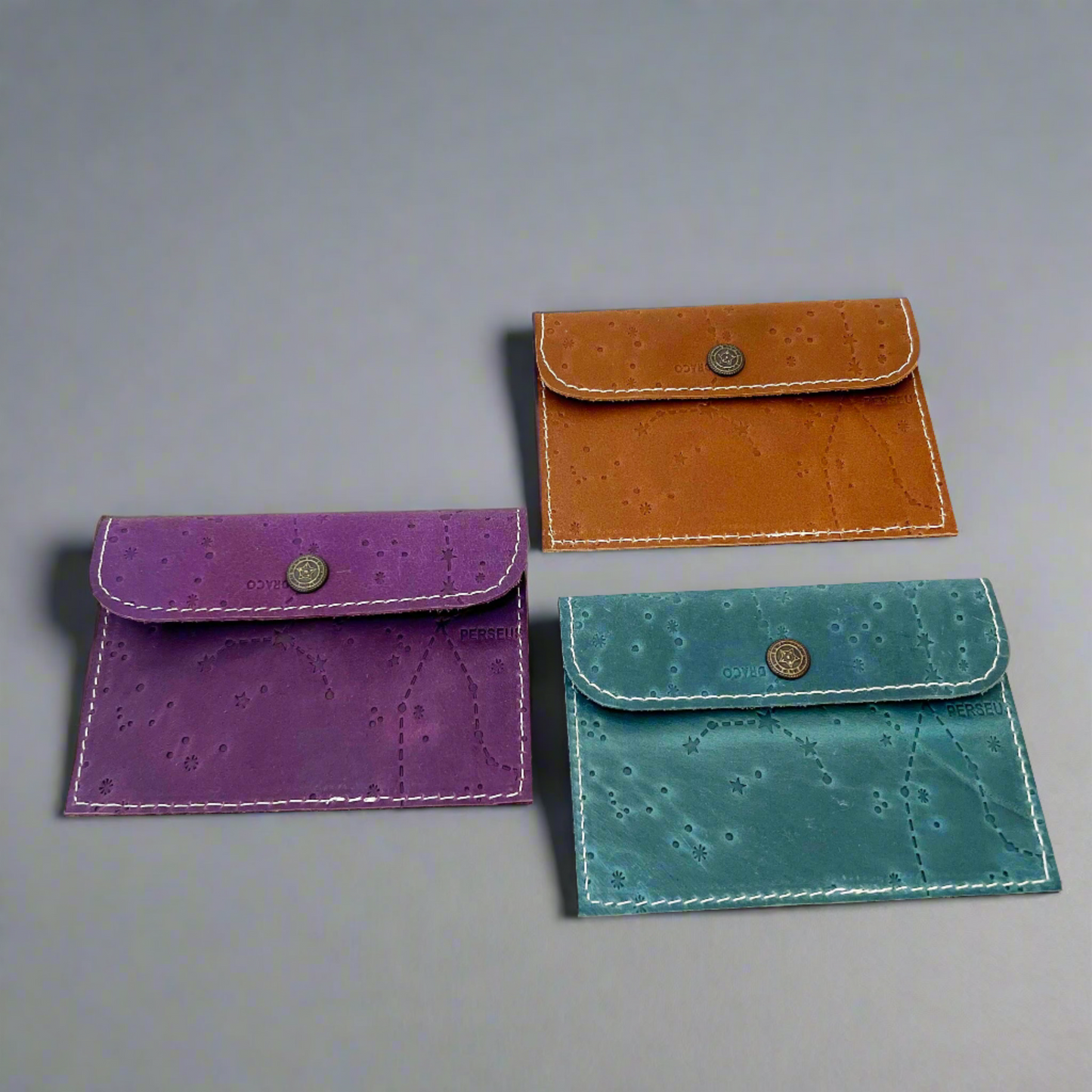 Leather envelope wallet with celestial constellation pattern – available in teal, purple, and brown for a dreamy, star-kissed touch of elegance