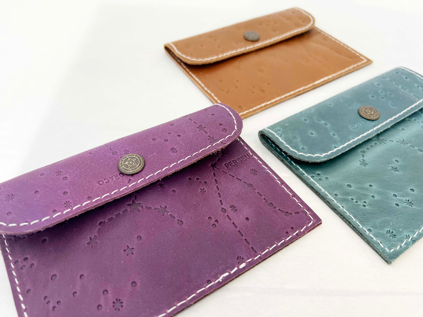 Leather envelope wallet with celestial constellation pattern – available in teal, purple, and brown for a dreamy, star-kissed touch of elegance
