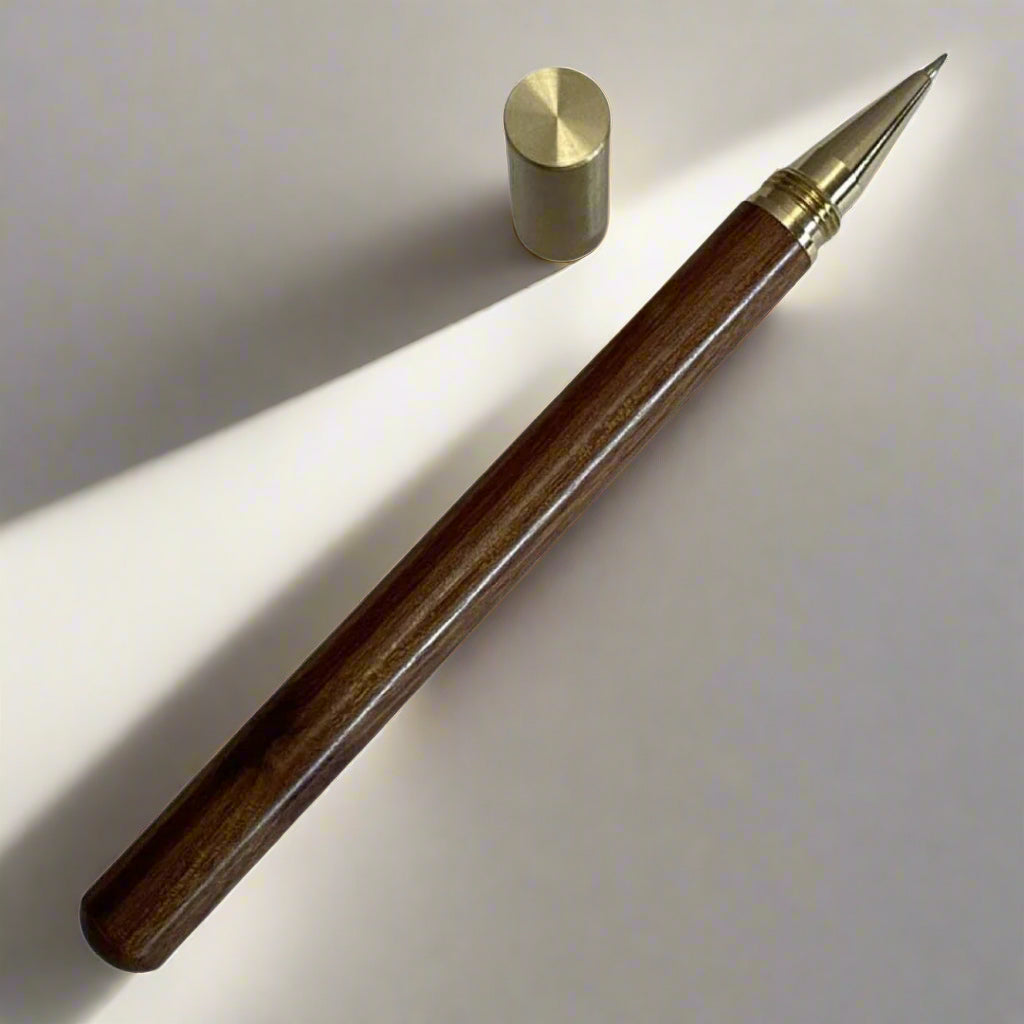 Handcrafted wood pen in oak and ebony with metallic gold accents – timeless elegance for refined writing