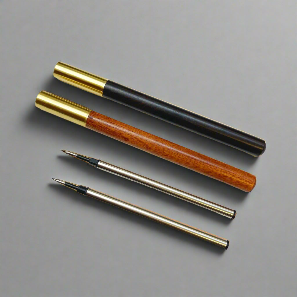 Handcrafted wood pen in oak and ebony with metallic gold accents – timeless elegance for refined writing