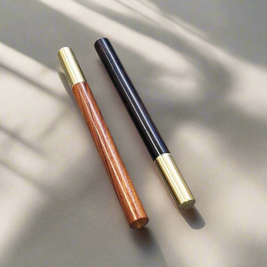 Handcrafted wood pen in oak and ebony with metallic gold accents – timeless elegance for refined writing