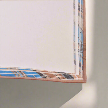 Plaid patterned paper with a white background