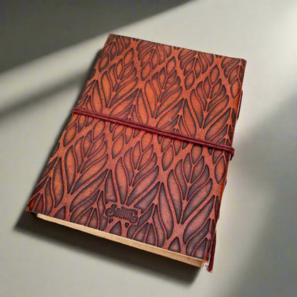 Earth-toned leather journal featuring embossed life quote – thoughtful companion for journaling and sketching on the go
