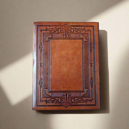 Decorative wooden frame with intricate carvings on a brown background