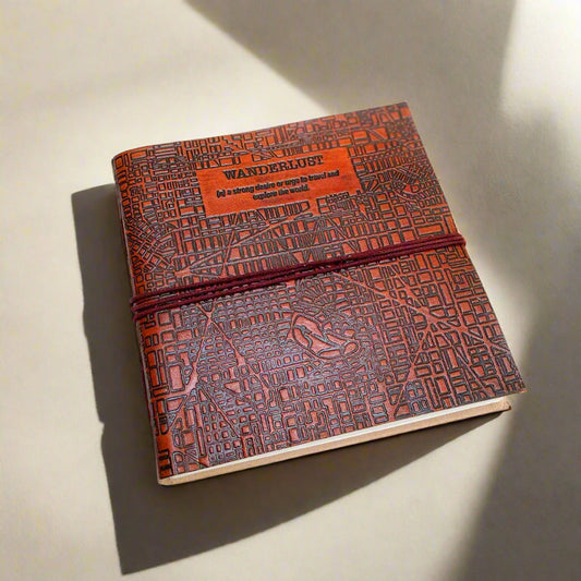 Leather journal with “Wanderlust” engraving – travel-inspired, handcrafted notebook for writing, sketching, and adventure journaling