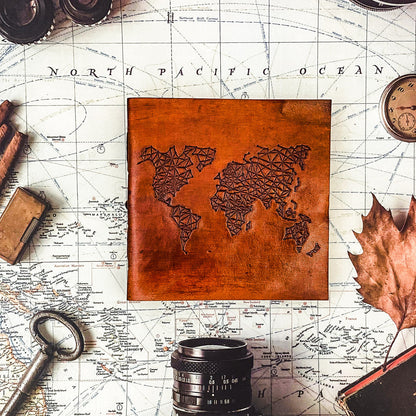 Adventure-ready leather journal – world map embossing for documenting memories from every corner of the globe