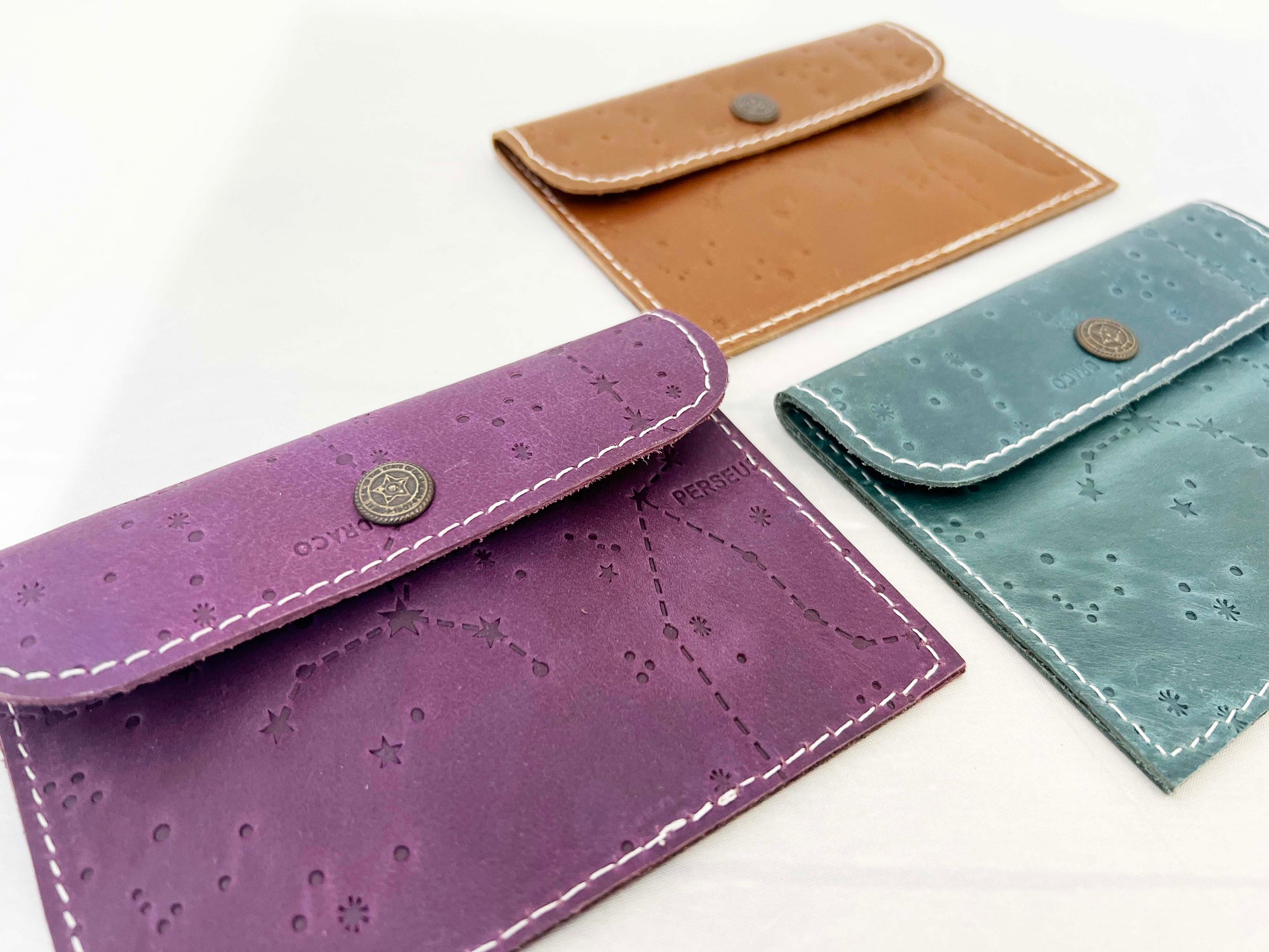 Leather envelope wallet with celestial constellation pattern – available in teal, purple, and brown for a dreamy, star-kissed touch of elegance