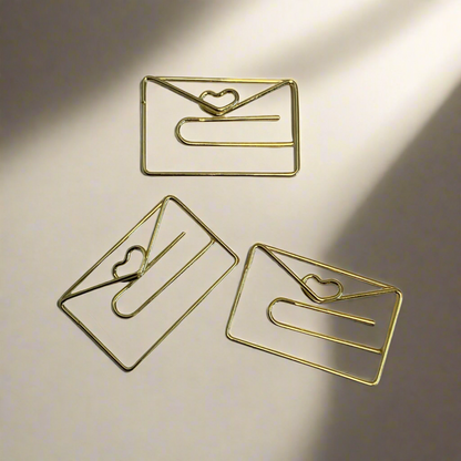 Stylish gold paper clips in unique geometric shapes – modern, functional, and perfect for adding flair to your workspace