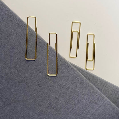 Stylish gold paper clips in unique geometric shapes – modern, functional, and perfect for adding flair to your workspace