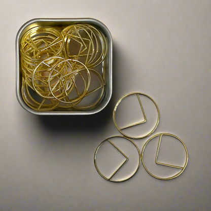 Stylish gold paper clips in unique geometric shapes – modern, functional, and perfect for adding flair to your workspace
