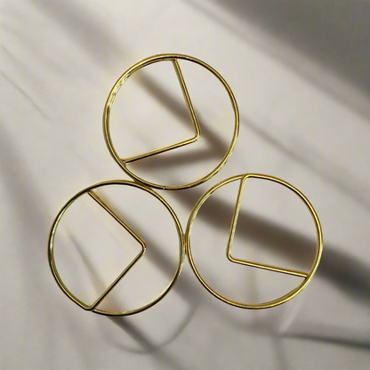 Stylish gold paper clips in unique geometric shapes – modern, functional, and perfect for adding flair to your workspace