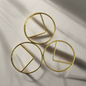 Stylish gold paper clips in unique geometric shapes – modern, functional, and perfect for adding flair to your workspace