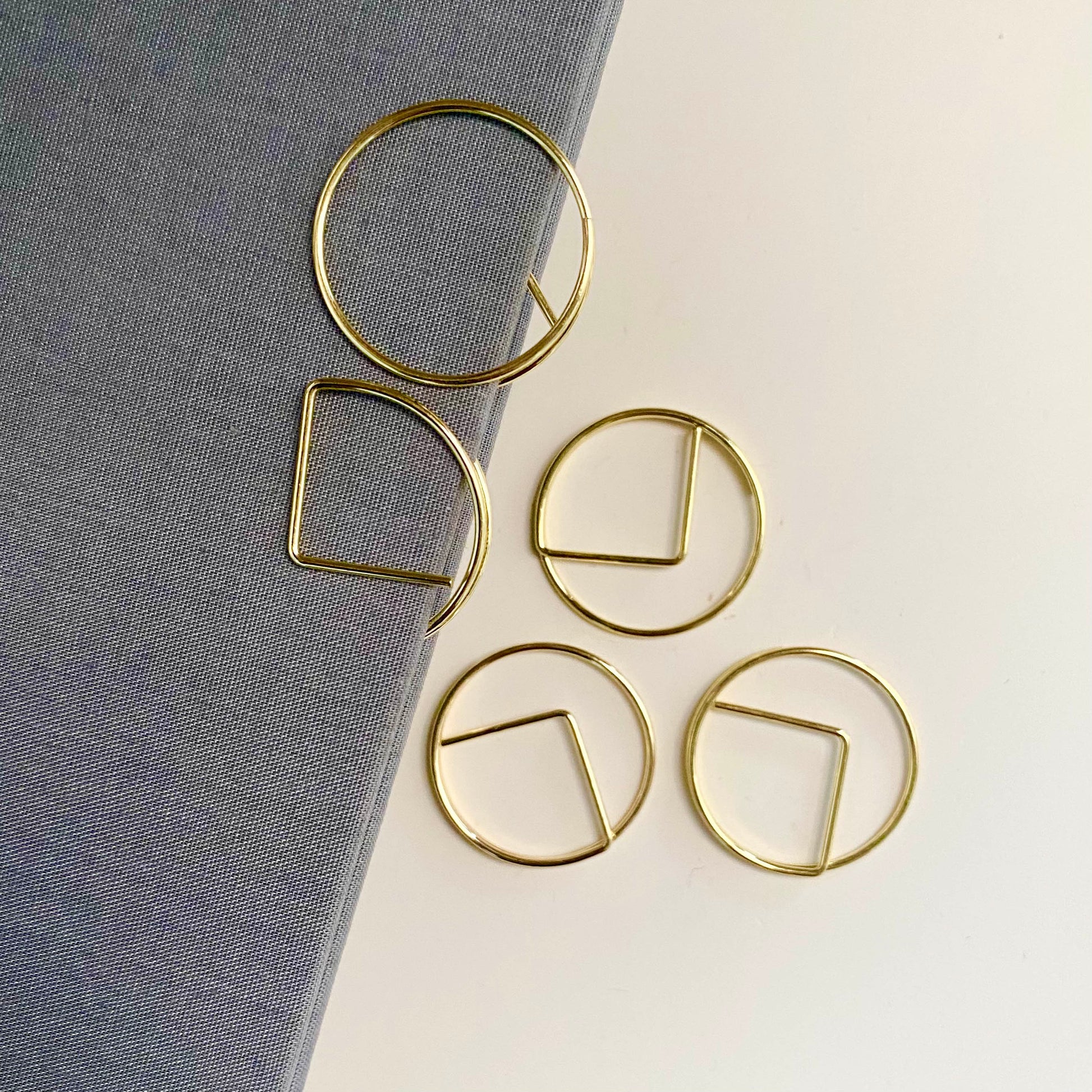 Stylish gold paper clips in unique geometric shapes – modern, functional, and perfect for adding flair to your workspace