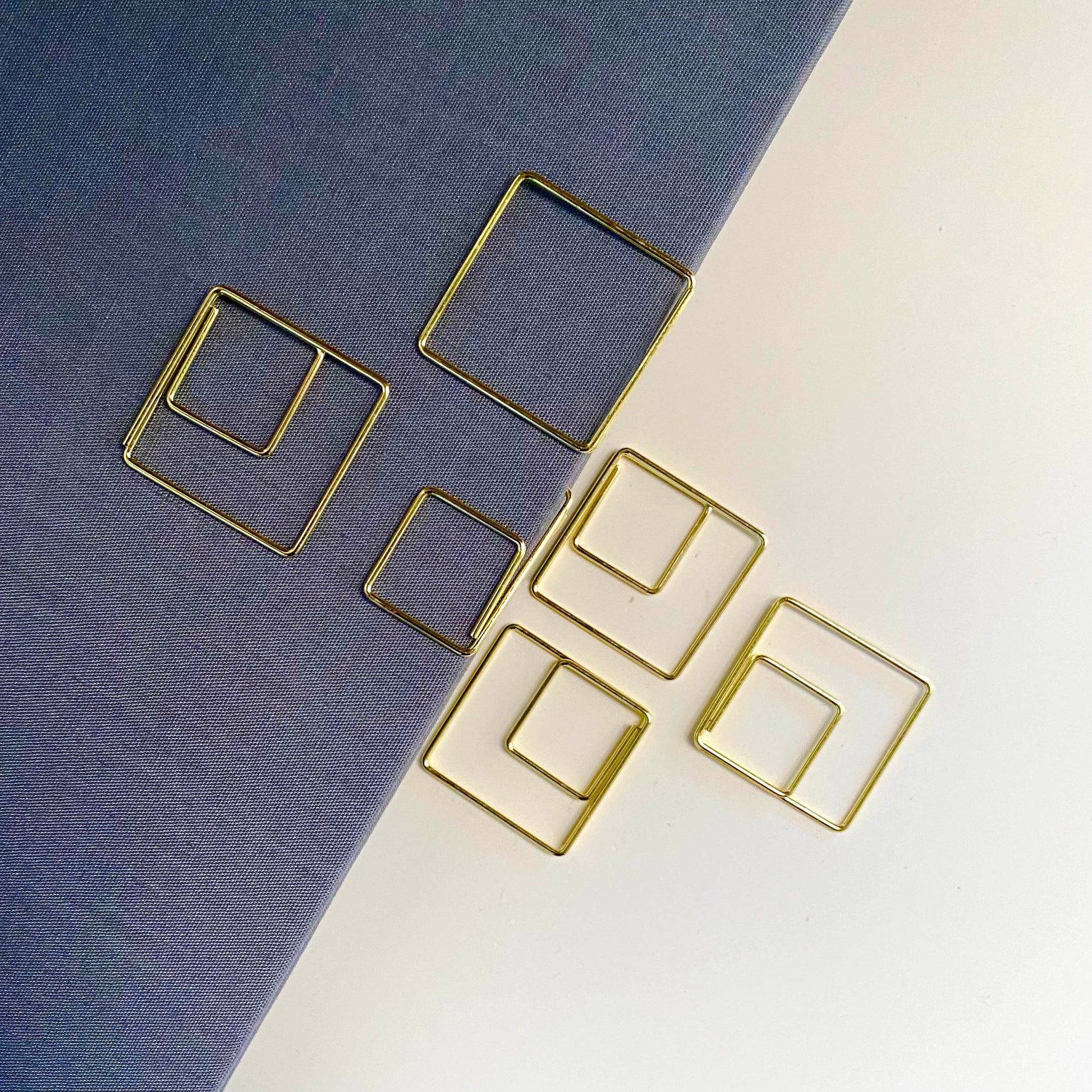 Stylish gold paper clips in unique geometric shapes – modern, functional, and perfect for adding flair to your workspace