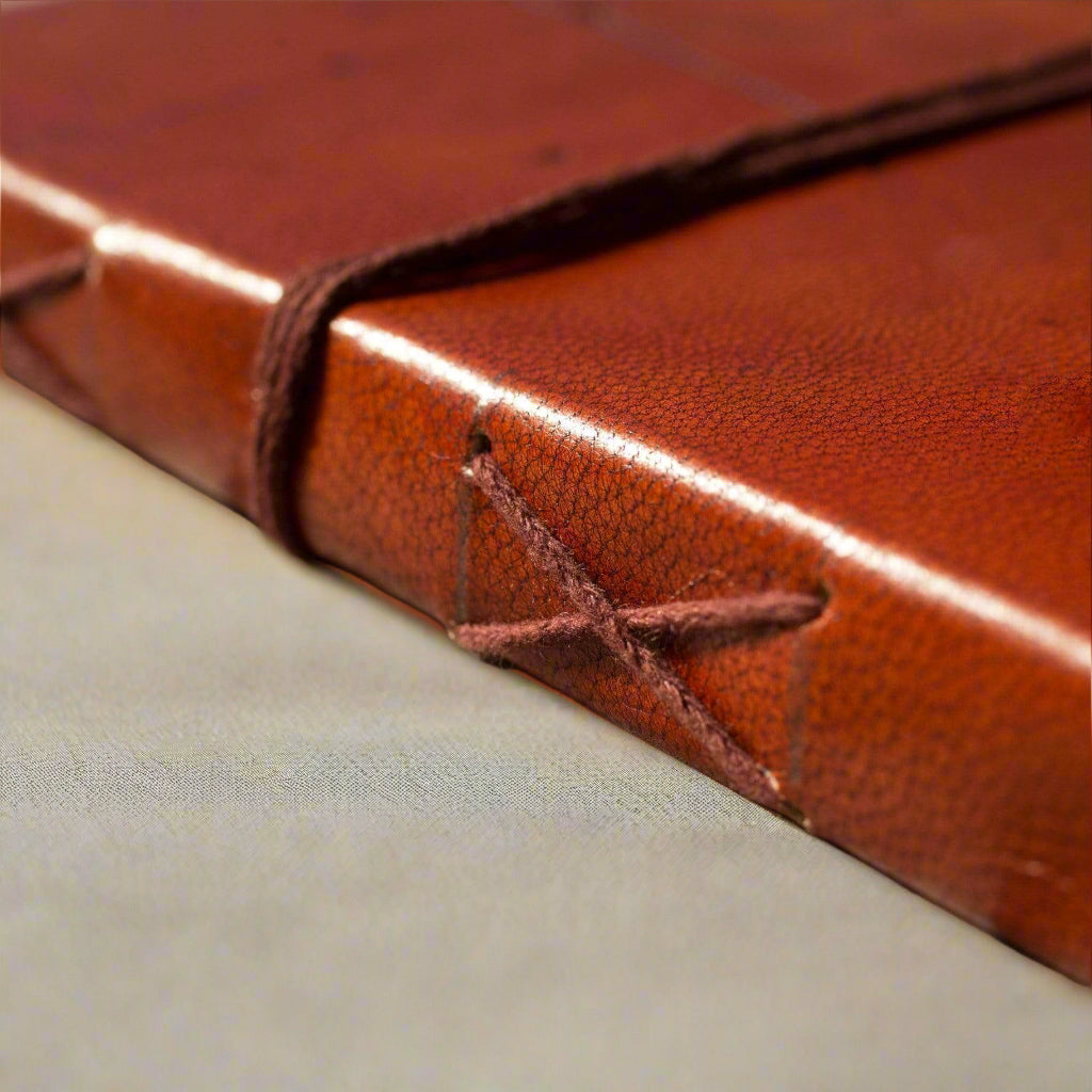 Rustic leather-bound journal with ‘Trust the Journey’ embossed – sustainable and artisanal notebook