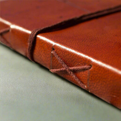 Earth-toned leather journal featuring embossed life quote – thoughtful companion for journaling and sketching on the go