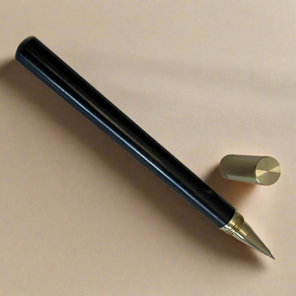 Handcrafted wood pen in oak and ebony with metallic gold accents – timeless elegance for refined writing